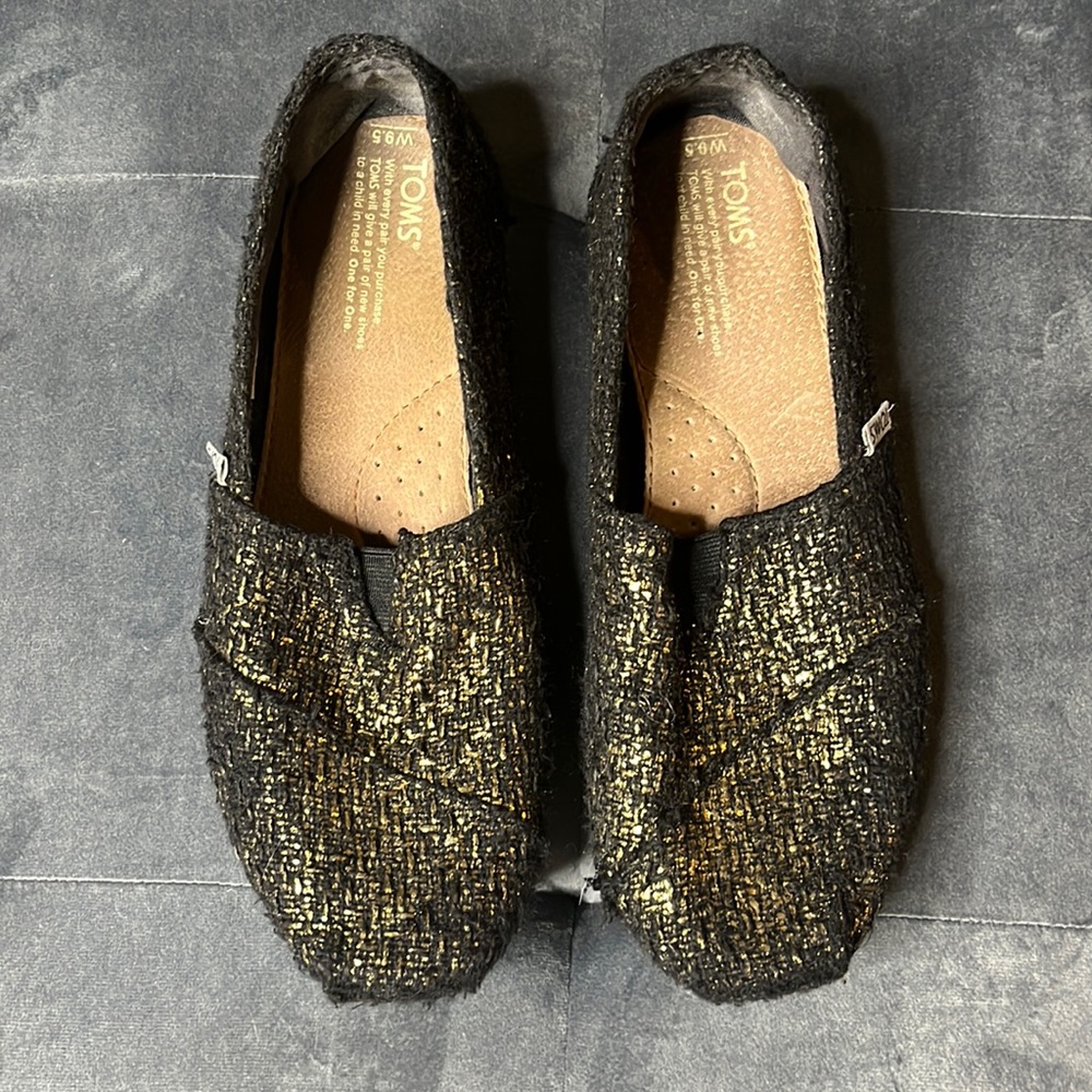 Tom’s Black and Gold Metallic Shoes